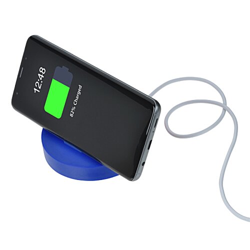 Additional Image 3 - a phone charging on a wireless charger