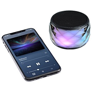 Additional Image 2 - a cell phone and a round speaker