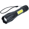 a black flashlight with a yellow label