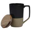 a black and tan coffee mug with a wooden lid