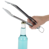 a person holding tongs over a bottle