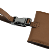 a brown leather strap with a silver buckle