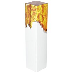 a white rectangular object with gold paint on it