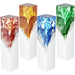 a group of white pillars with different colored stones