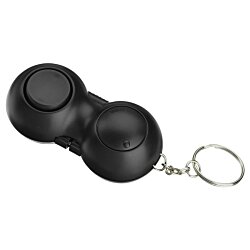 a black key chain with a black circle on it