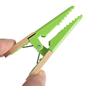 Additional Image 2 - a person holding a green clothes pin
