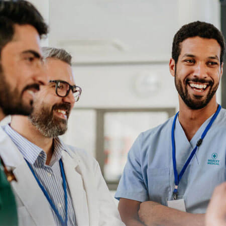  Team of medical staff talking at the hospital