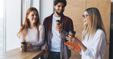 Group of coworkers on a break drinking coffee