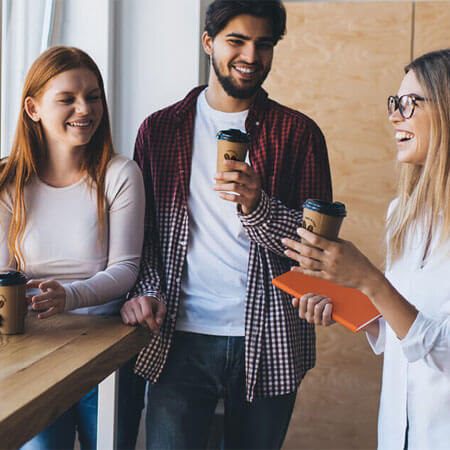 Group of coworkers on a break drinking coffee