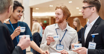 group of event attendees talking over coffee