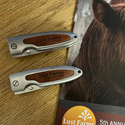 2 Rosewood Pocket Knives on a brochure