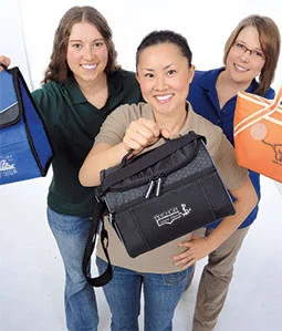 3 Models Holding Bags