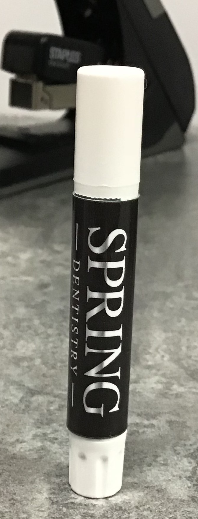 a black and white stick with white text