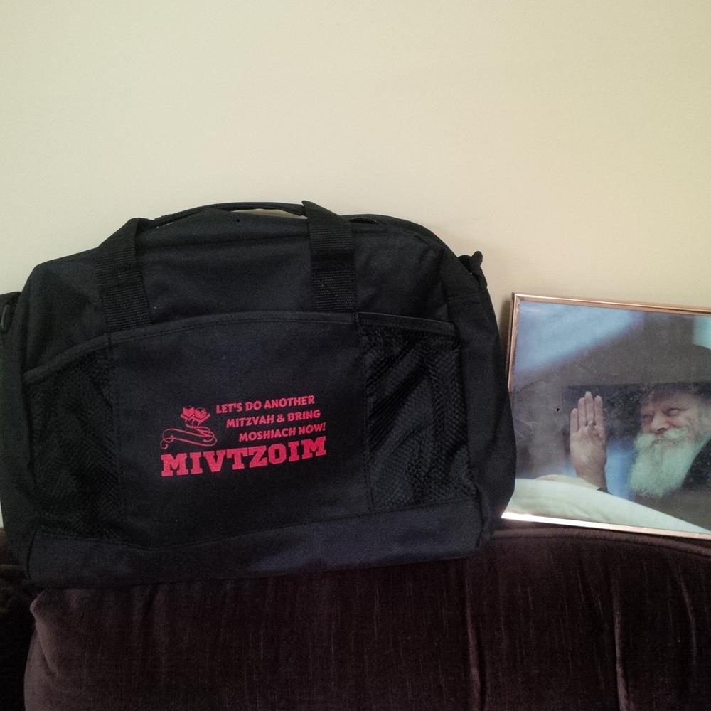 a black bag next to a picture
