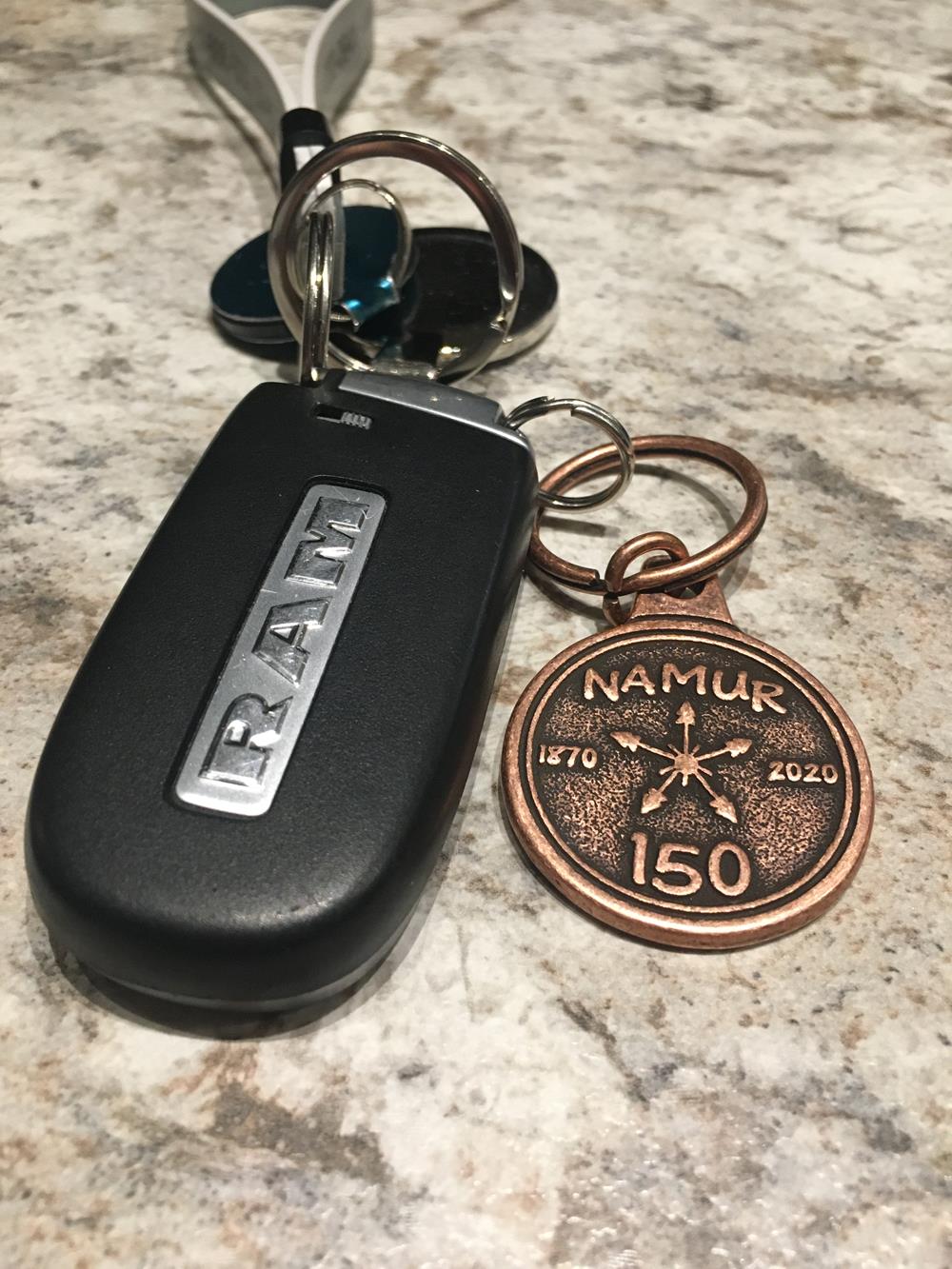 a key chain and a coin