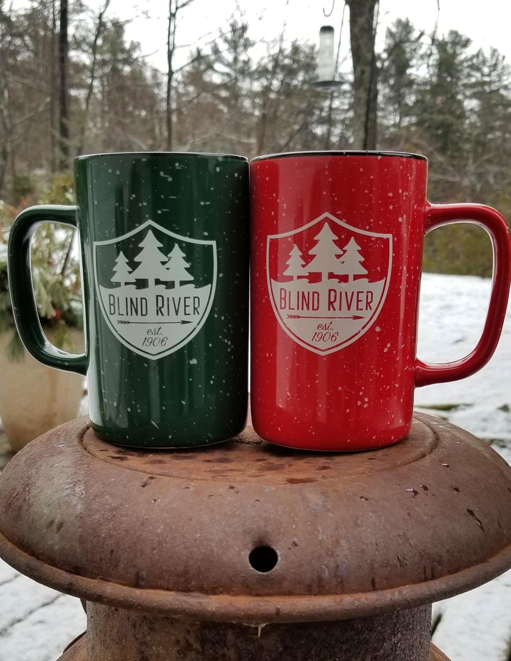 two mugs on a metal surface
