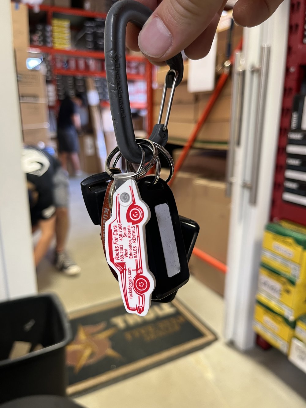 Customer photo from Bob of our Car Soft Keychain - Opaque, a hand holding a key chain