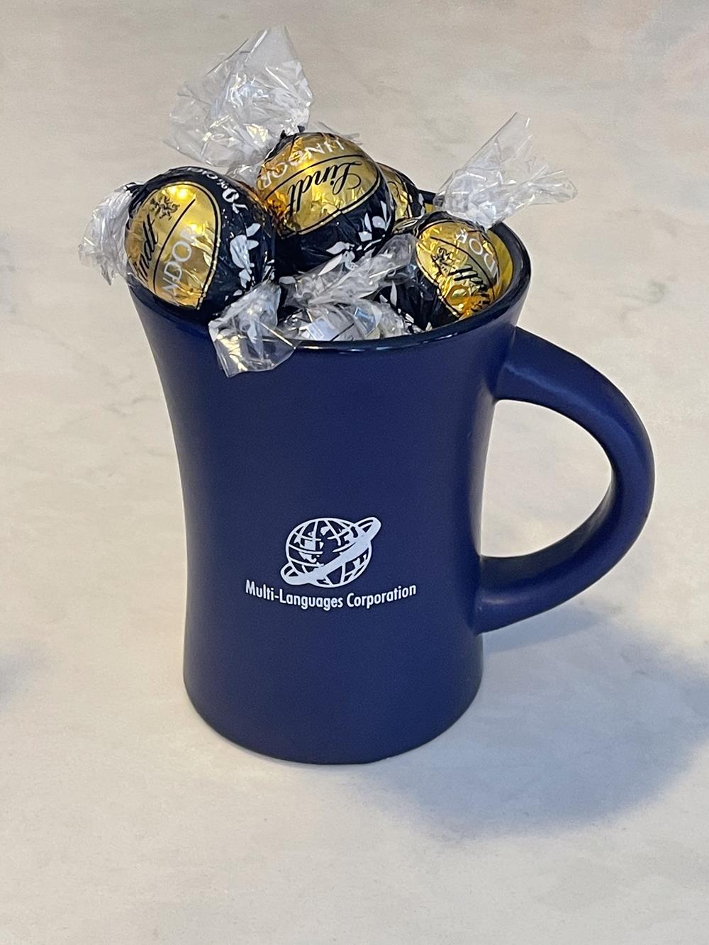 a blue mug filled with chocolate candies