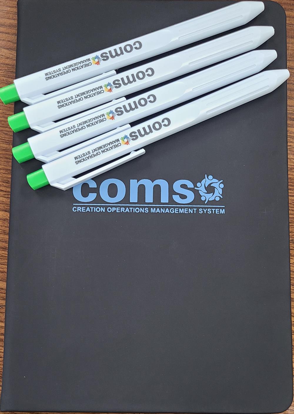 a group of pens on a pad