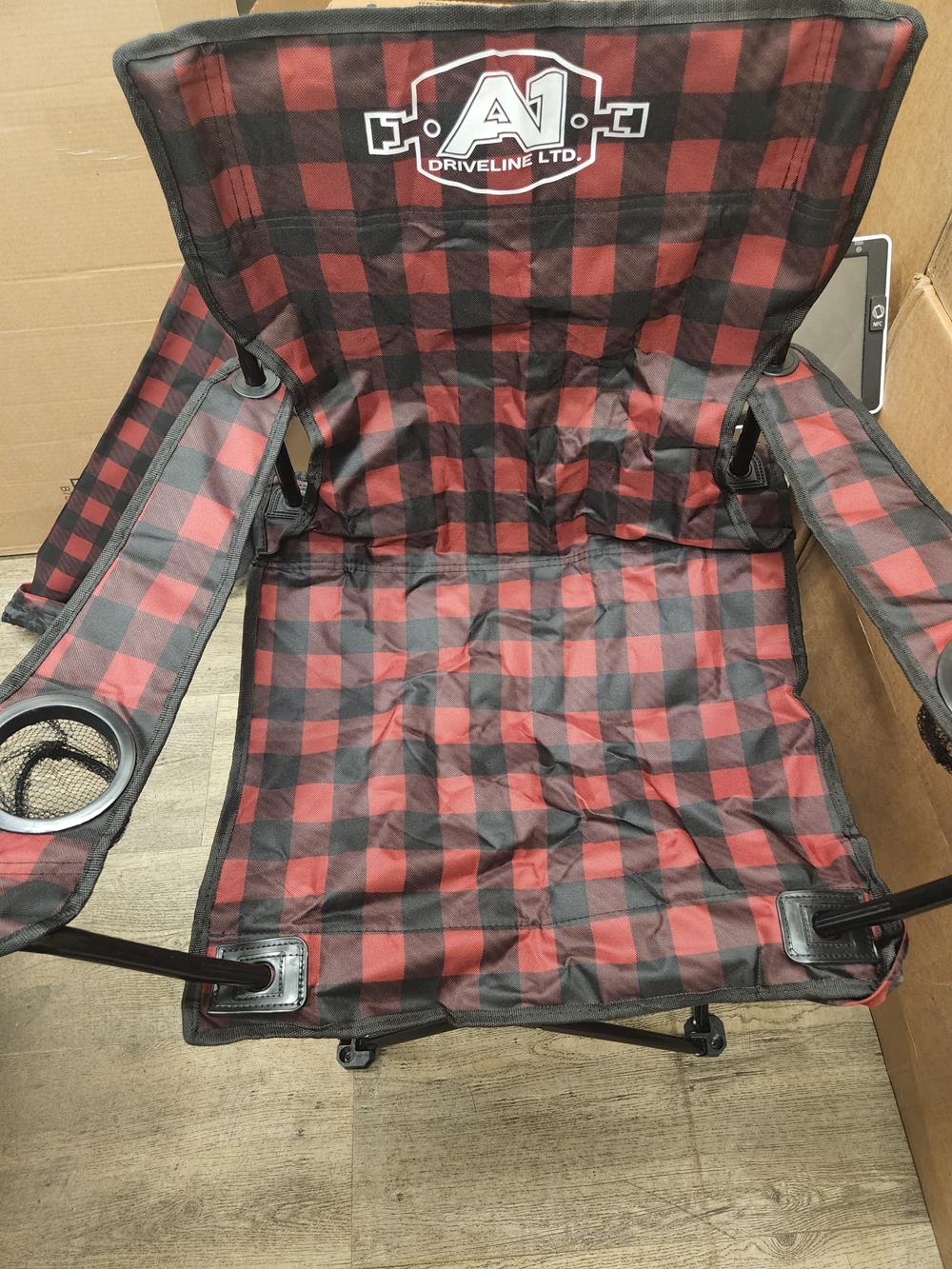 a red and black plaid folding chair
