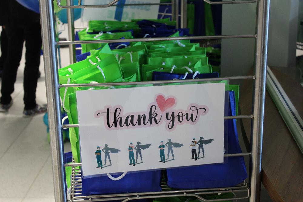 Customer photo from Kiana of our Hang In There Lanyard - 40" - 24 hr, a group of bags on a rack