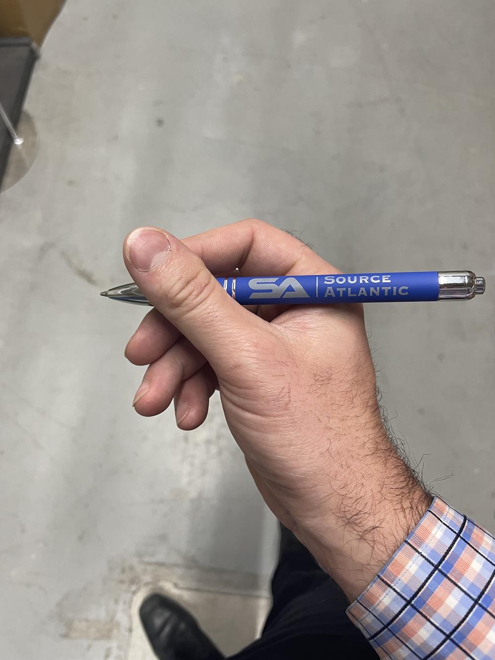 a hand holding a pen