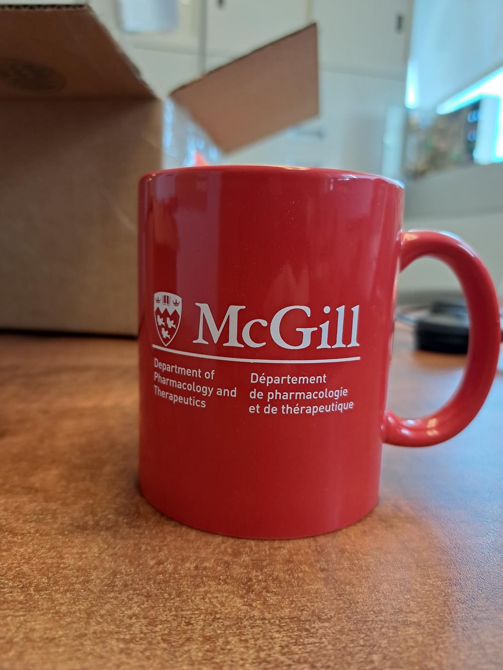 a red coffee mug on a table