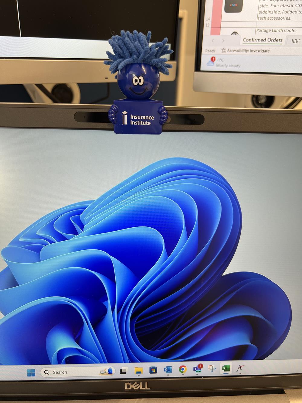 a computer screen with a blue sculpture