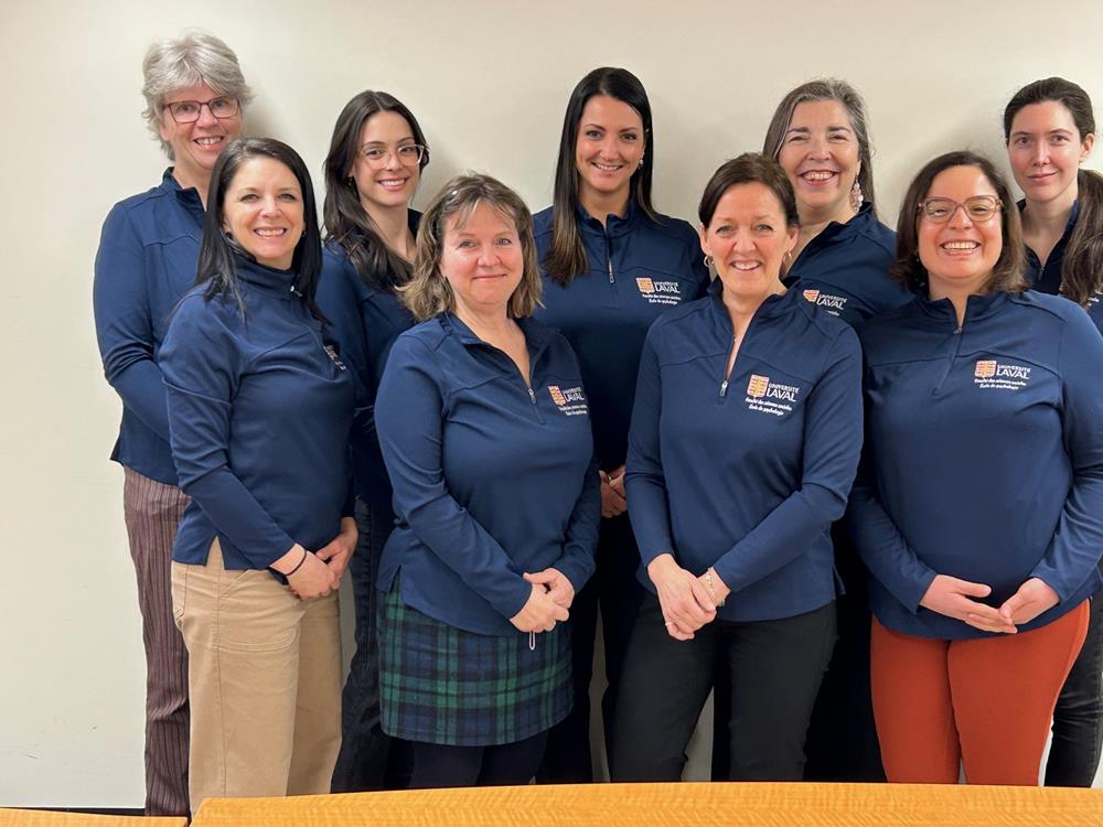 a group of women in blue shirts