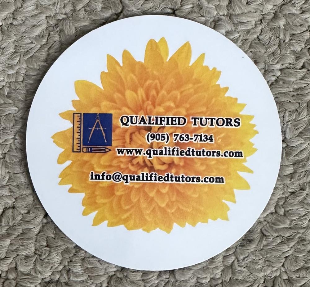 a circular white paper with a yellow flower on it