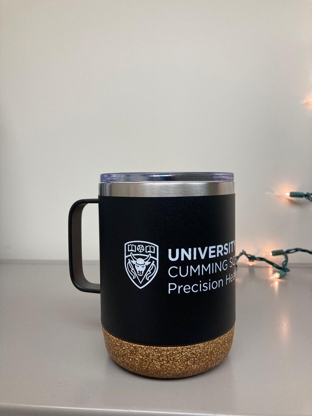 a black and gold coffee mug