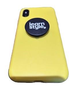 Customer photo from Alison of our Swappable PopSockets PopGrip, a yellow cell phone with a black circle on the side