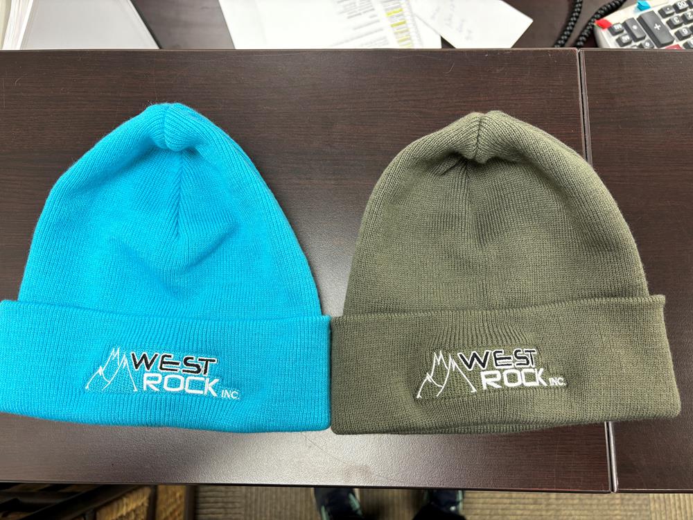 Customer photo from Kathy of our Fine Knit Toque with Cuff, two hats on a table