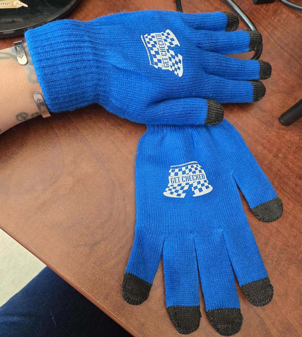 Customer photo from Angela of our Crossland Soft Shell Jacket - Men's, a pair of blue gloves on a table