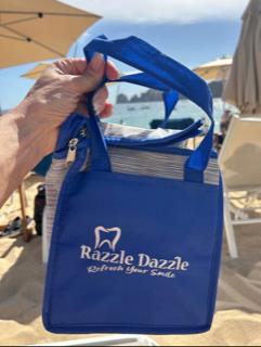 Customer photo from Tara of our Chilton Keychain-Closeout, a hand holding a blue bag