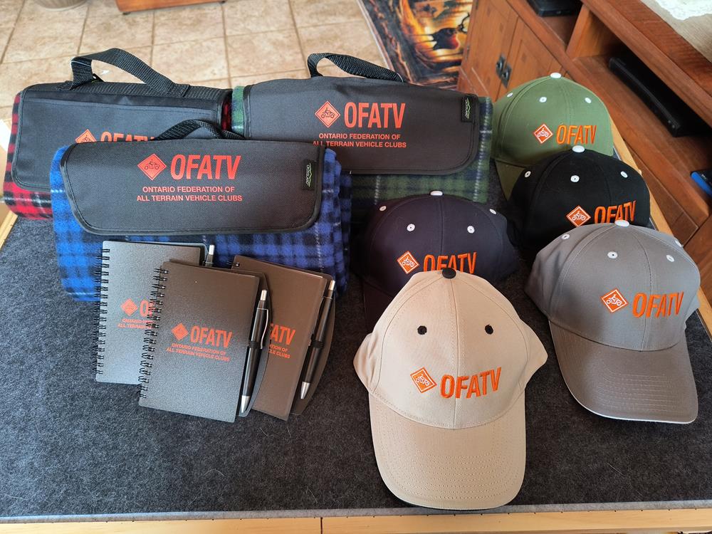 Customer photo from Denise of our Crossland Picnic Blanket - Screen, a group of hats and notebooks on a table