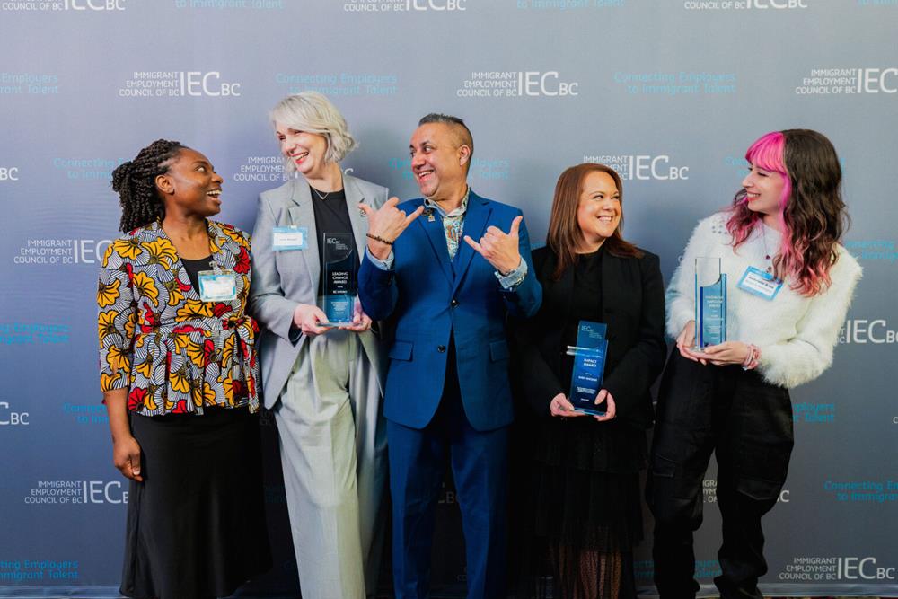 Customer photo from Vania of our Harmony Crystal Award, a group of people holding awards