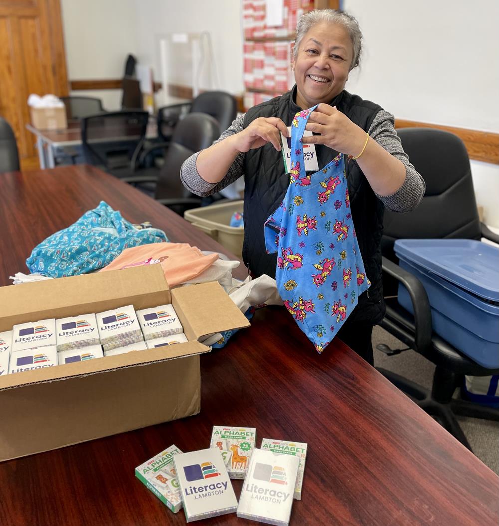 Customer photo from Tracy of our Flash Cards - Alphabet, a woman holding a blue tie