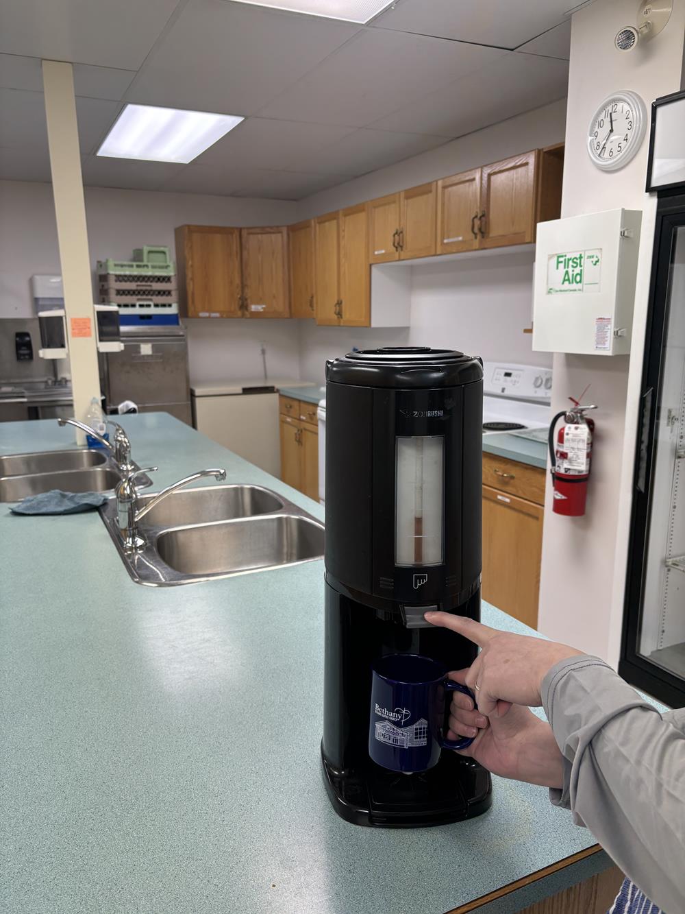 Customer photo from Lilian of our Value Coffee Mug - 11 oz. - Colours, a person holding a coffee cup