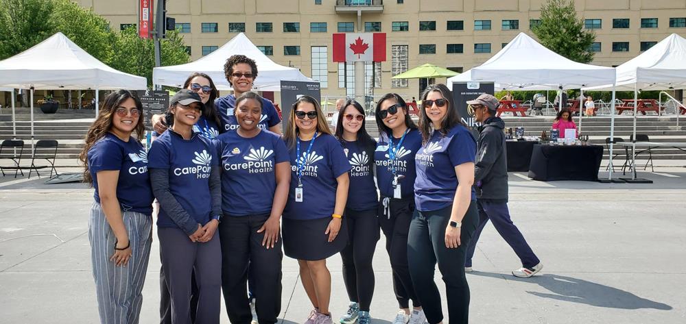Customer photo from Alicia of our Gildan Heavy Cotton T-Shirt - Ladies' - Screen, a group of women wearing matching shirts