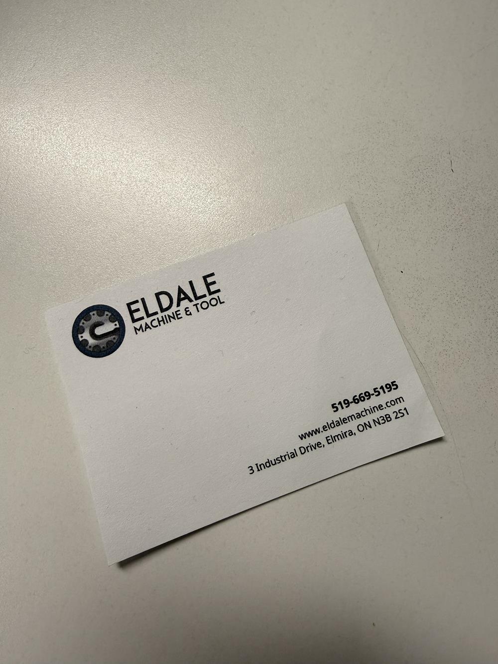 Customer photo from Rythum of our Souvenir Sticky Note - 3" x 4" - 25 Sheet, a white business card with black text and blue logo
