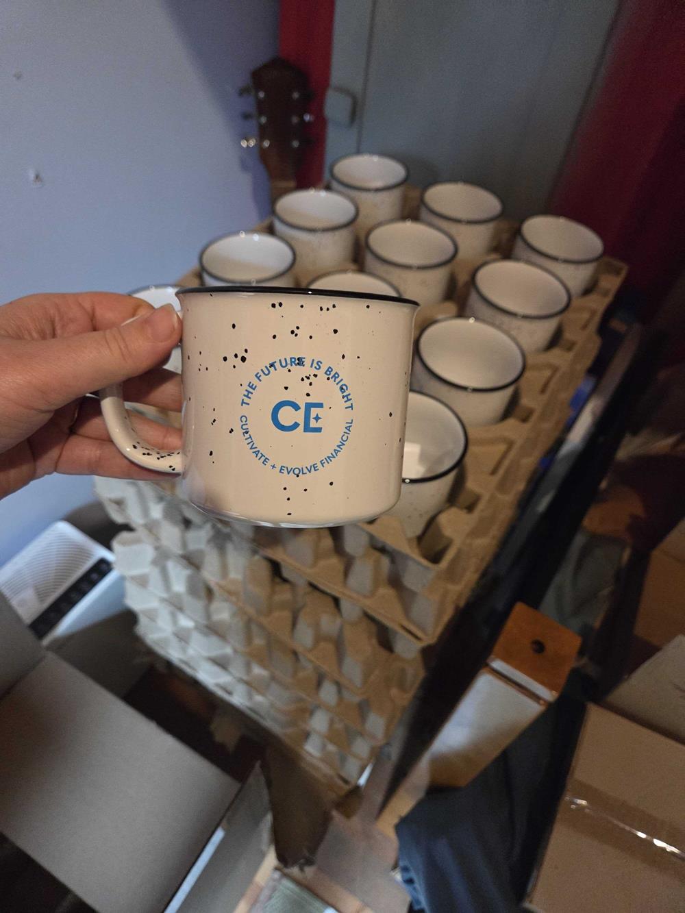 Customer photo from Andrew of our Campfire Ceramic Mug - White - 15 oz, a hand holding a mug