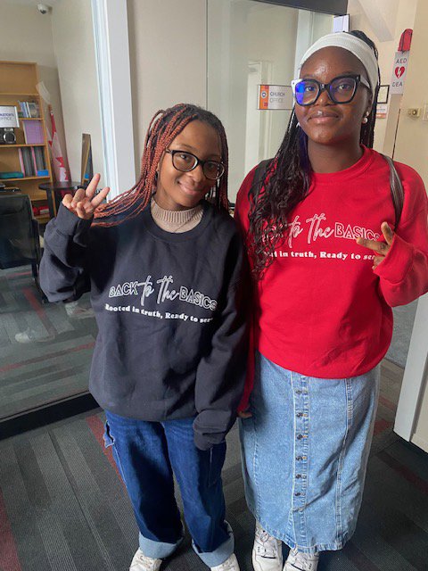 Customer photo from Babatunde of our Gildan 50/50 Heavy Blend Crew Sweatshirt - Screen, two women standing in a room