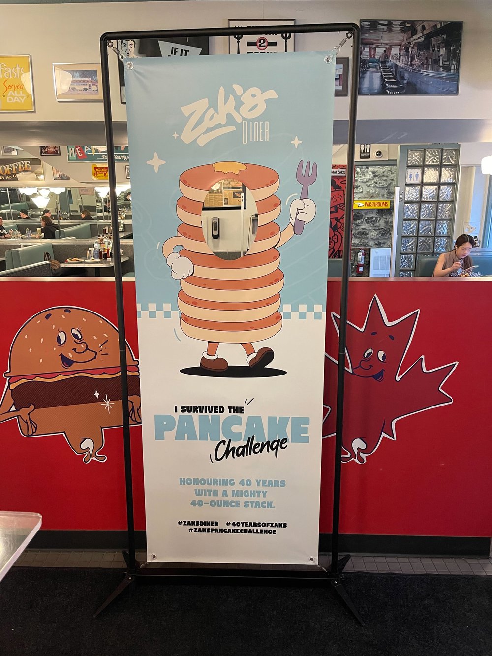 Customer photo from James of our FrameWorx Banner Stand - Single Face Cut Out, a sign with a cartoon character on it