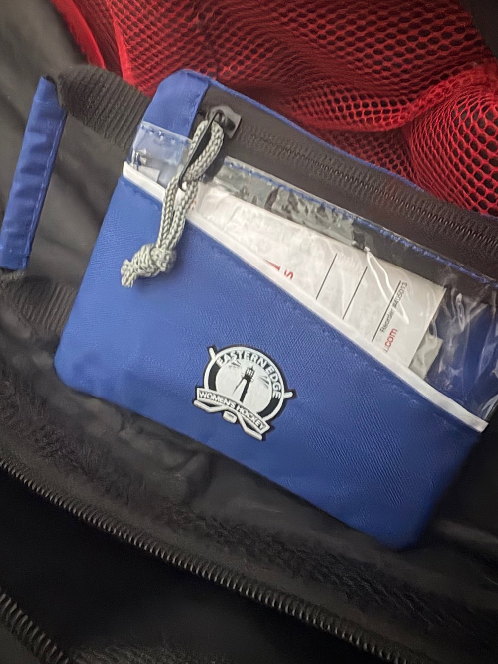 Customer photo from Sarah of our Elastic Wristband Hair Tie, a blue pouch with a zipper