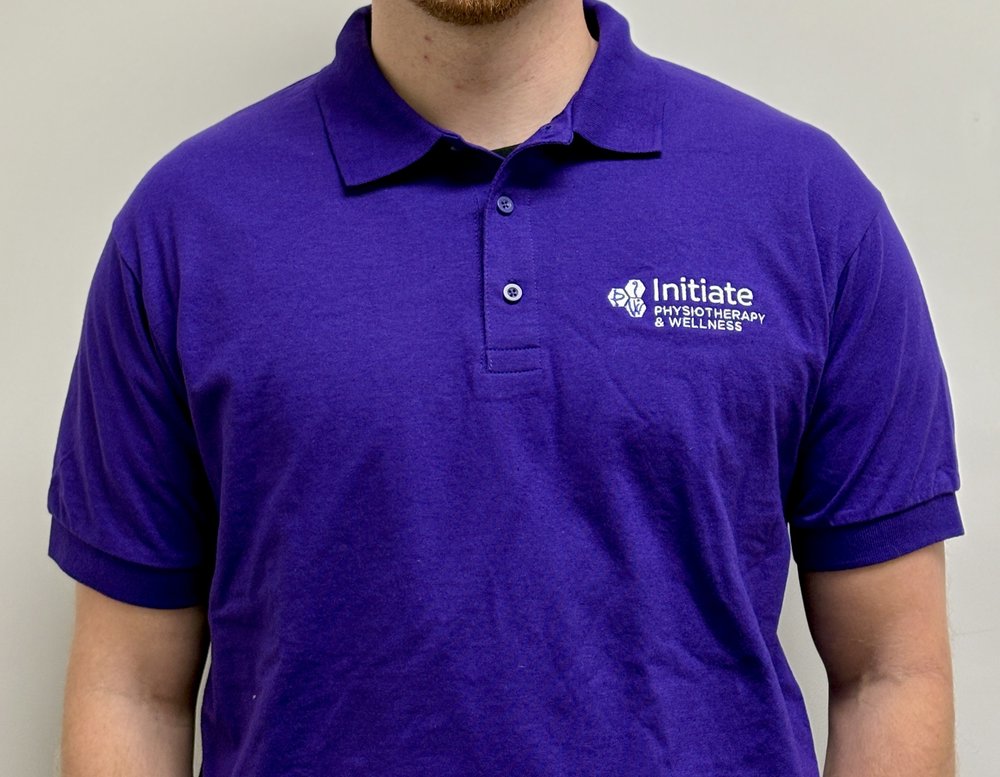 Customer photo from Initiate of our Gildan DryBlend 50/50 Jersey Polo, a man wearing a purple polo shirt
