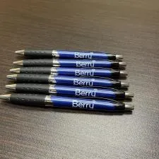 a group of pens on a table