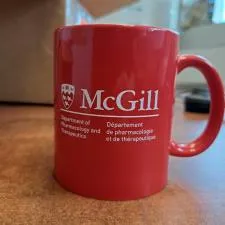 Customer photo from Chantal of our Value Coffee Mug - 11 oz. - Colours, a red coffee mug on a table