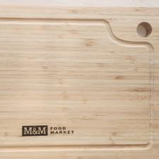 a wooden cutting board with a logo on it