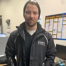 Customer photo from Patti of our Crossland Heather Fleece Jacket - Ladies', a man in a black jacket